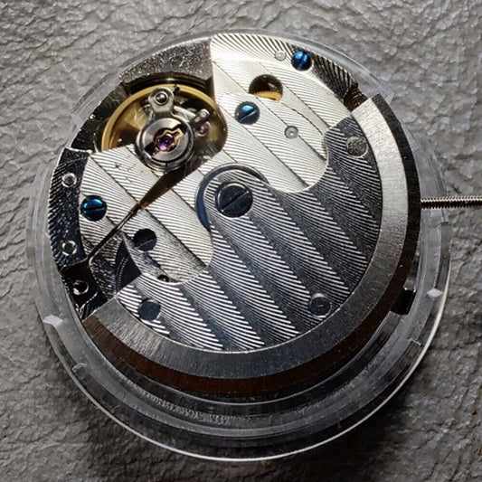 Seagull ST16 automatic watch movement with small seconds at 3, 6, and 9 o'clock positions, China made.