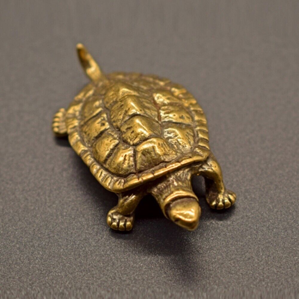 Solid copper longevity turtle figurine with vintage bronze carvings, ideal for showcasing watch accessories.
