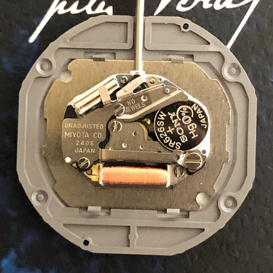 Quartz watch movement Miyota 2405 with day, date, and 3 hands, perfect for precise watch repairs.