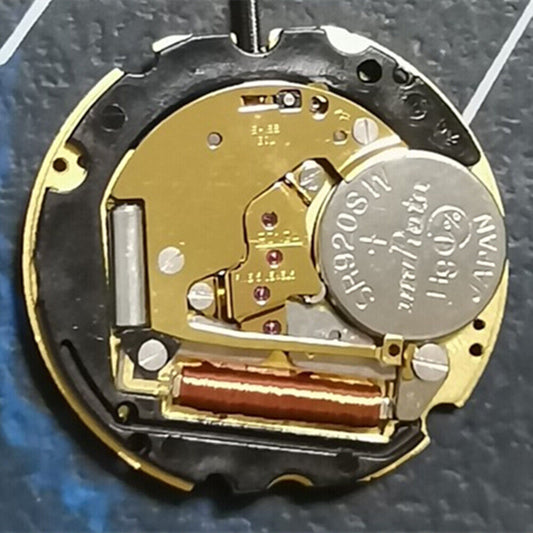 Ronda 705 golden quartz watch movement with date at 3, Swiss made for watch repair parts.