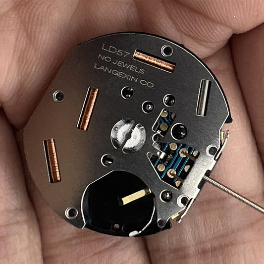 LD57 quartz watch movement with small second hand positioned at 6, 9, or 12 o'clock for repair parts.