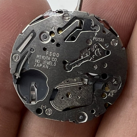 Miyota FS00 quartz watch movement repair part, compatible with F500 models, precise timekeeping component.
