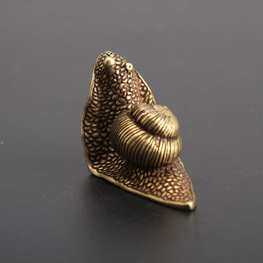 Vintage hand-carved bronze little snail figurine by Solid Copper, perfect for watch accessory display.