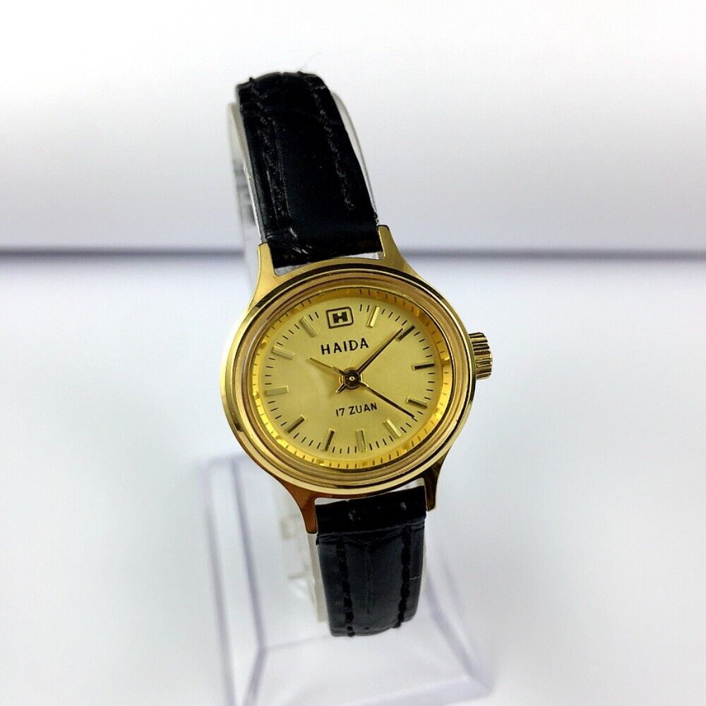 HAIDA 24mm golden mechanical lady watch with 17 jewels and elegant oval nail-style case design.