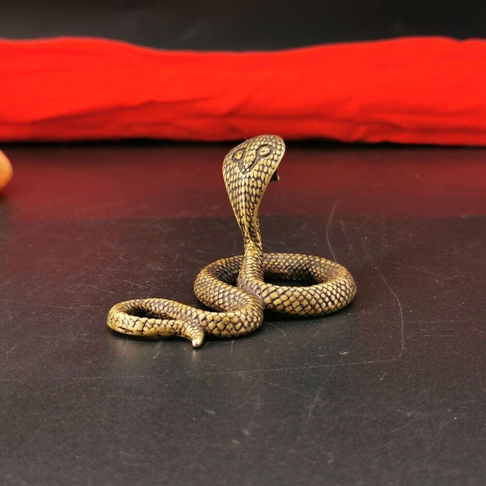 Hand-carved solid copper Little Cobra trinket with intricate details, perfect collectible from.
