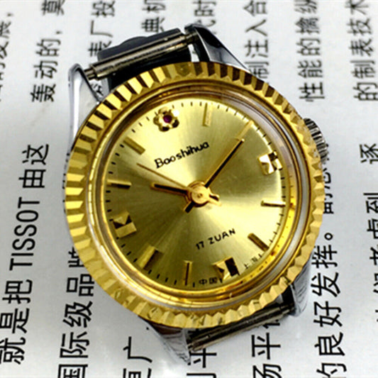 Shanghai 24mm lady watch with golden nail markers, round gold case, and manual mechanical 3-hand movement.