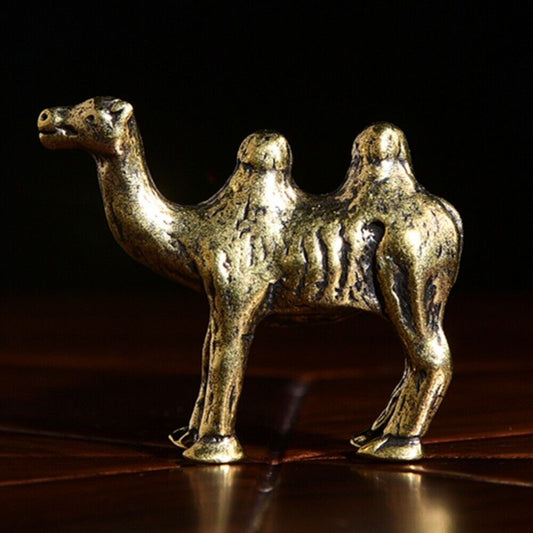 Hand-carved solid copper camel trinket, vintage bronze-toned collectible figurine.