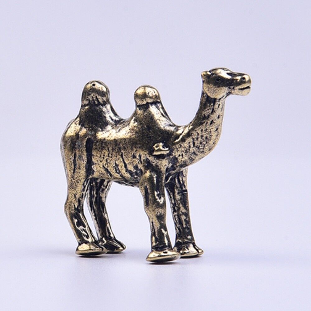 Hand-carved solid copper camel trinket, vintage bronze-toned collectible accessory.