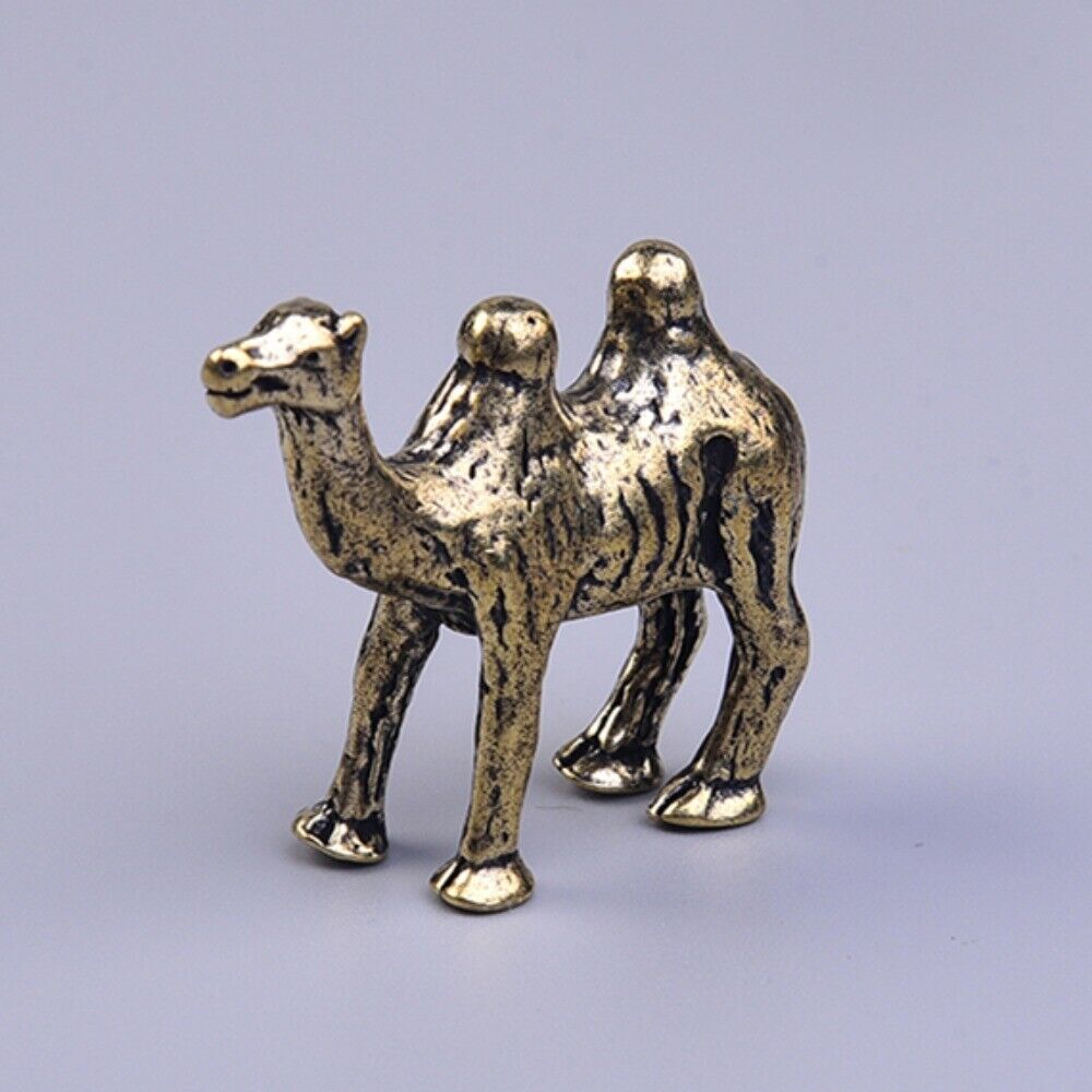 Hand-carved solid copper camel trinket, vintage bronze-toned collectible for decor and gifting.