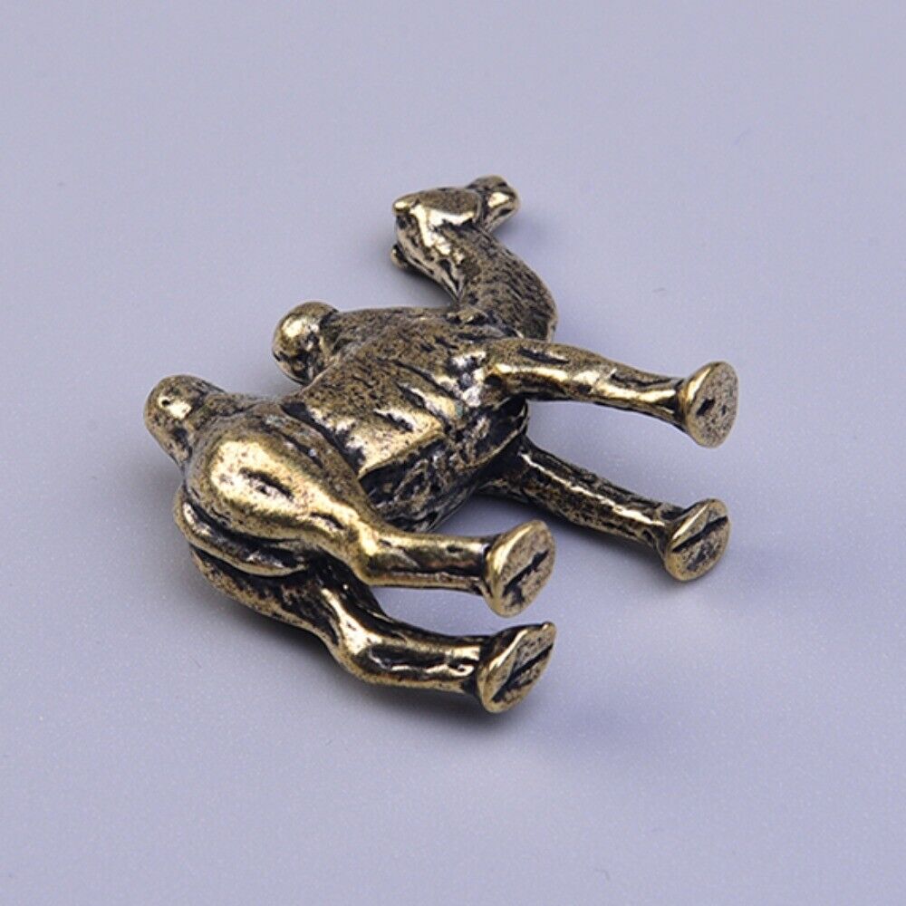 Hand-carved solid copper camel trinket, vintage bronze-toned collectible for watch enthusiasts.