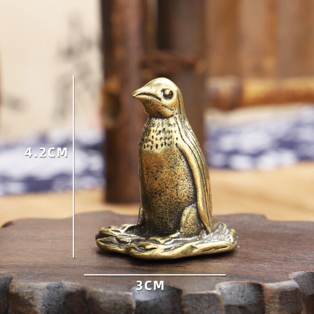 Solid copper penguin trinket with hand-carved bronze details, perfect collectible.