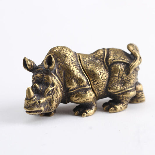 Hand-carved vintage bronze rhinoceros figurine by Solid Copper, perfect for watch accessory display.