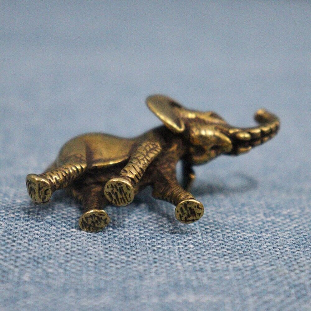 Hand-carved solid copper elephant trinket, vintage bronze figurine for stylish home decor.