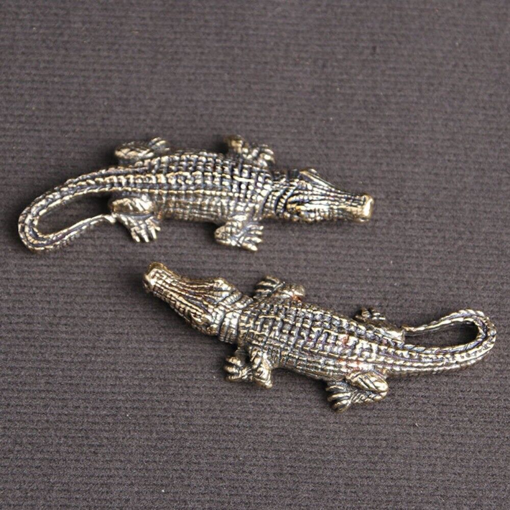 Hand-carved solid copper crocodile figurine by Bronze Model, detailed trinket for watch accessory displays.