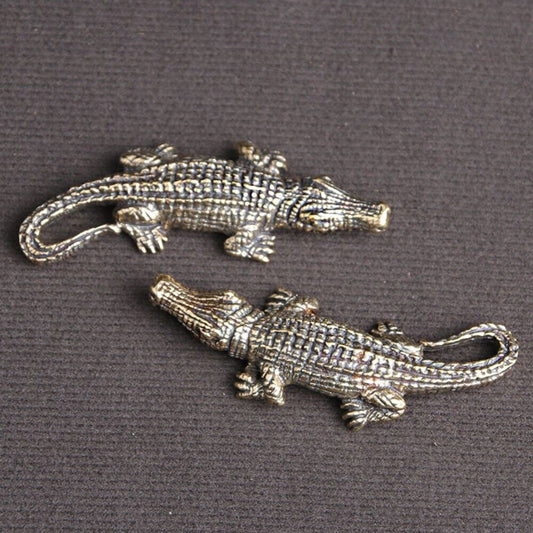 Hand-carved solid copper crocodile figurine by Bronze Model, detailed trinket for watch accessory displays.