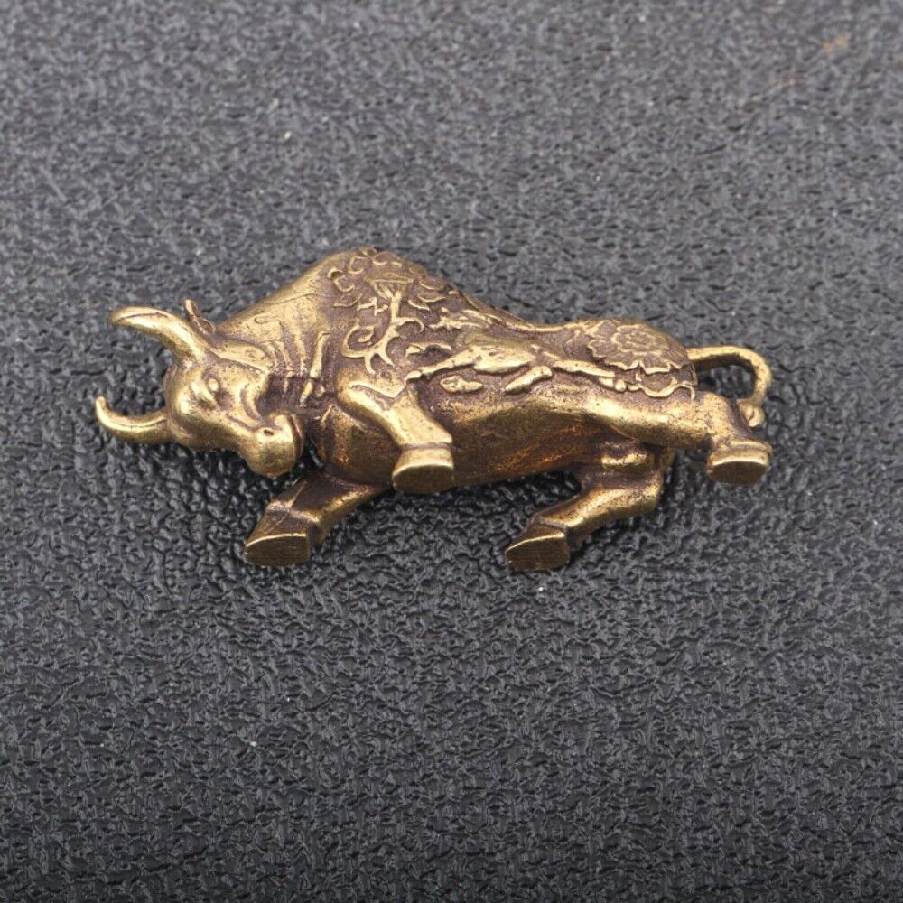 Solid copper bull figurine featuring detailed hand-carved bronze design, vintage collectible.