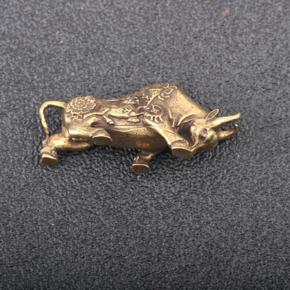Solid copper bull figurine featuring hand-carved bronze details, vintage collectible.