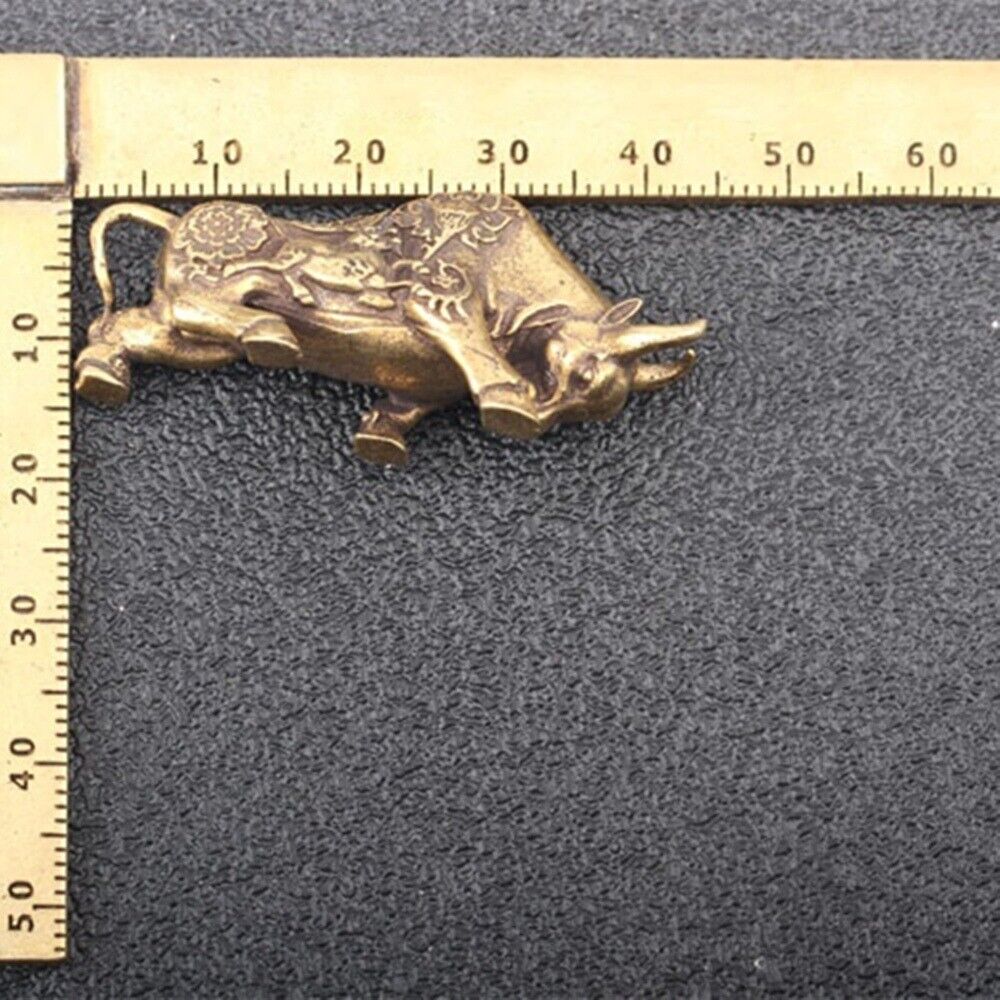 Solid copper bull figurine with intricate hand-carved bronze details, vintage collectible.