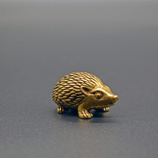 Solid copper little hedgehog trinket, vintage hand-carved bronze figurine detail.