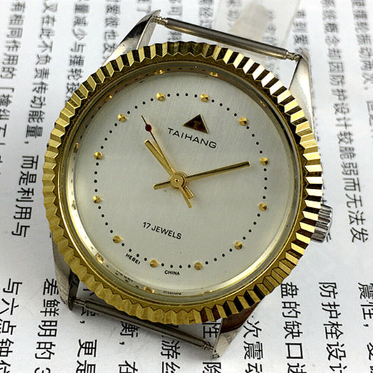 38mm TAIHANG manual watch with silver dial, round case, 3 hands, and 17 jewels for precision.