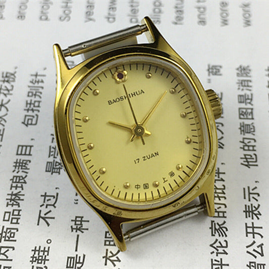 Shanghai brand 23mm lady watch with yellow oval dial, golden nail markers, and manual mechanical movement.