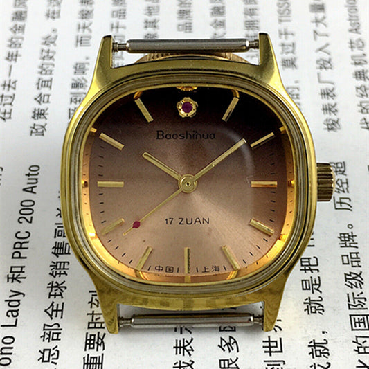 Shanghai 33mm manual mechanical watch with golden nails, 17 jewels, square case, and brown dial.