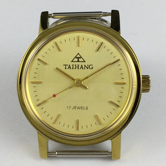 37mm TAIHANG manual mechanical watch with round golden case and yellow dial, featuring gold hour markers.