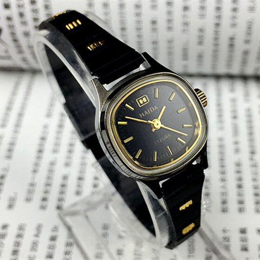 Haida 23mm manual mechanical lady watch with golden nail markers, black dial, and 3 hands for elegant style