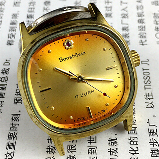33mm Shanghai watch with golden nail markers, 17 jewels, square case, and vibrant orange dial for classic style.