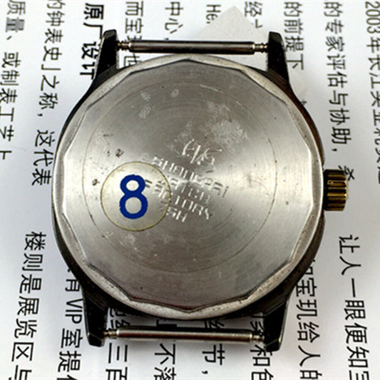 Shanghai Factory 34mm manual mechanical watch, black dial, 19 jewels, shock-resistant design.