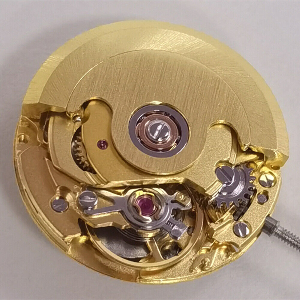 Golden mechanical watch featuring ETA2671 movement and date display at 3 o'clock for precise timekeeping.