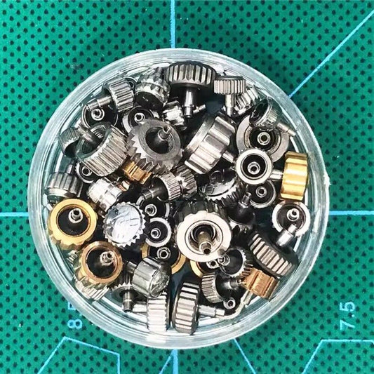 Set of 40-50 generic watch crowns for quartz and mechanical movement repairs.