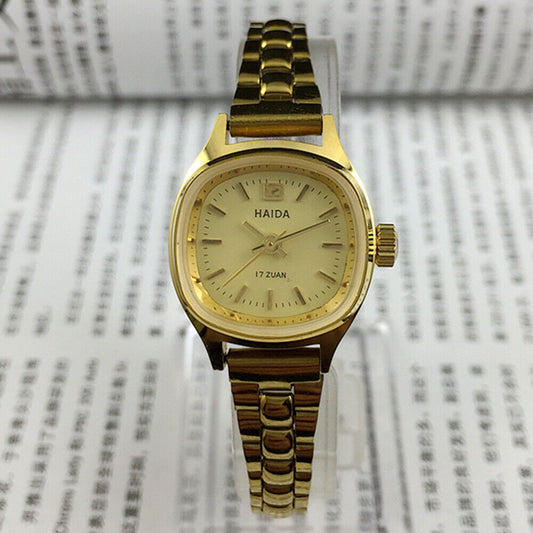 Elegant 24mm Shanghai Haida lady watch with golden nail accents and square mechanical case.