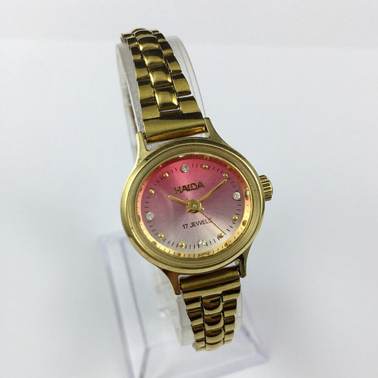 HAIDA 25mm manual mechanical lady watch with golden nail markers, 17 jewels, and gradient pink dial.