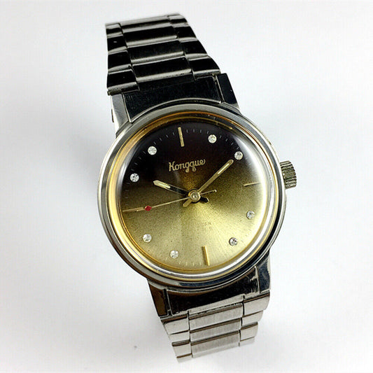 China Kongque Steel manual mechanical watch with 17 jewels, gradual golden brown dial, elegant design.