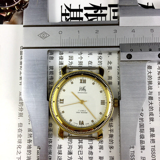 38mm Shanghai Factory manual mechanical watch with golden case, shock-resistant design for durability.