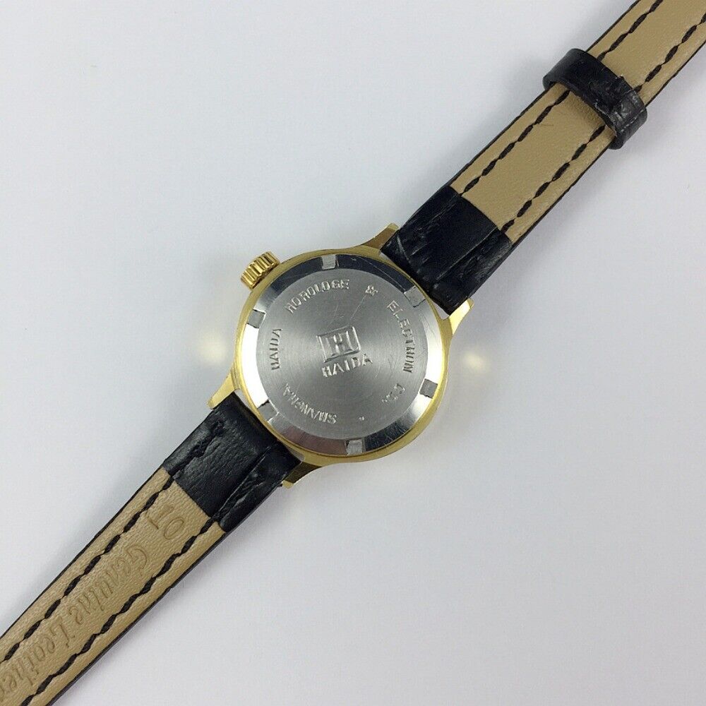 HAIDA Lady's manual mechanical watch with 17 jewels, golden nails, and gradient green oval dial for elegant wear.