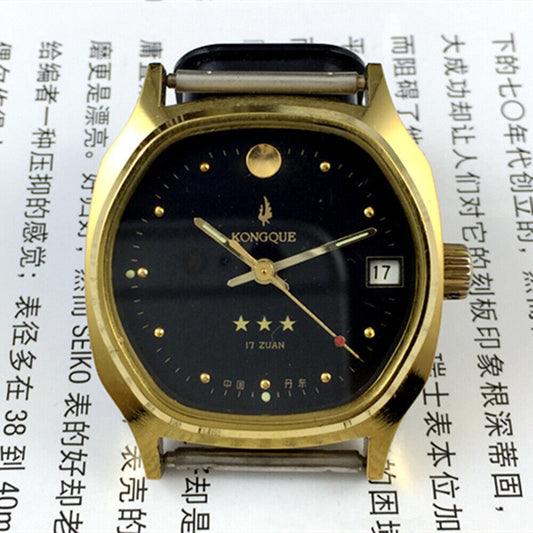 China Kongque Steel manual mechanical watch with 17 jewels, black dial, and gold-tone case for elegant style.