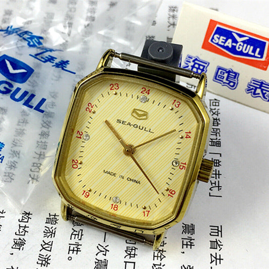 Seagull 28mm ladies watch with golden square case and manual mechanical movement, elegant design.