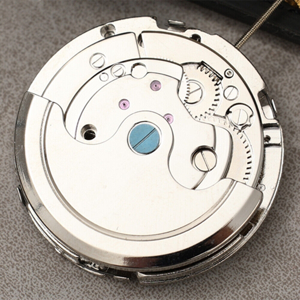 Dandong Asian Bare Balance Wheel automatic watch with date and week display on black dial.
