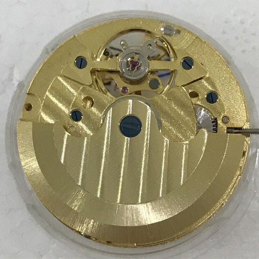 Golden automatic watch with multifunctional star and moon phase at 12 o?clock, mechanical movement at 6, premium design.