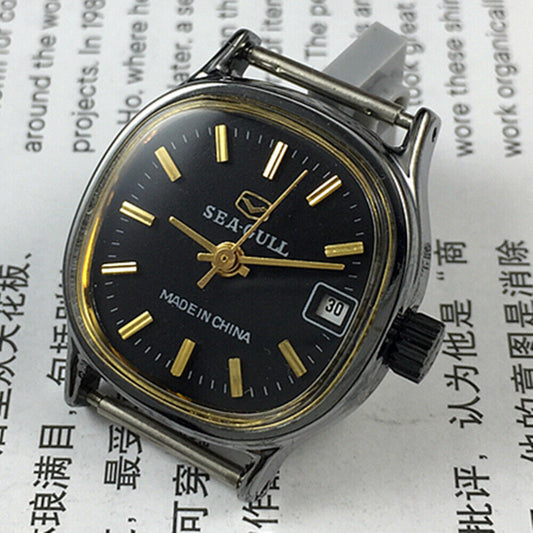 26mm Seagull manual mechanical lady watch with black case, golden nail markers, single calendar display.