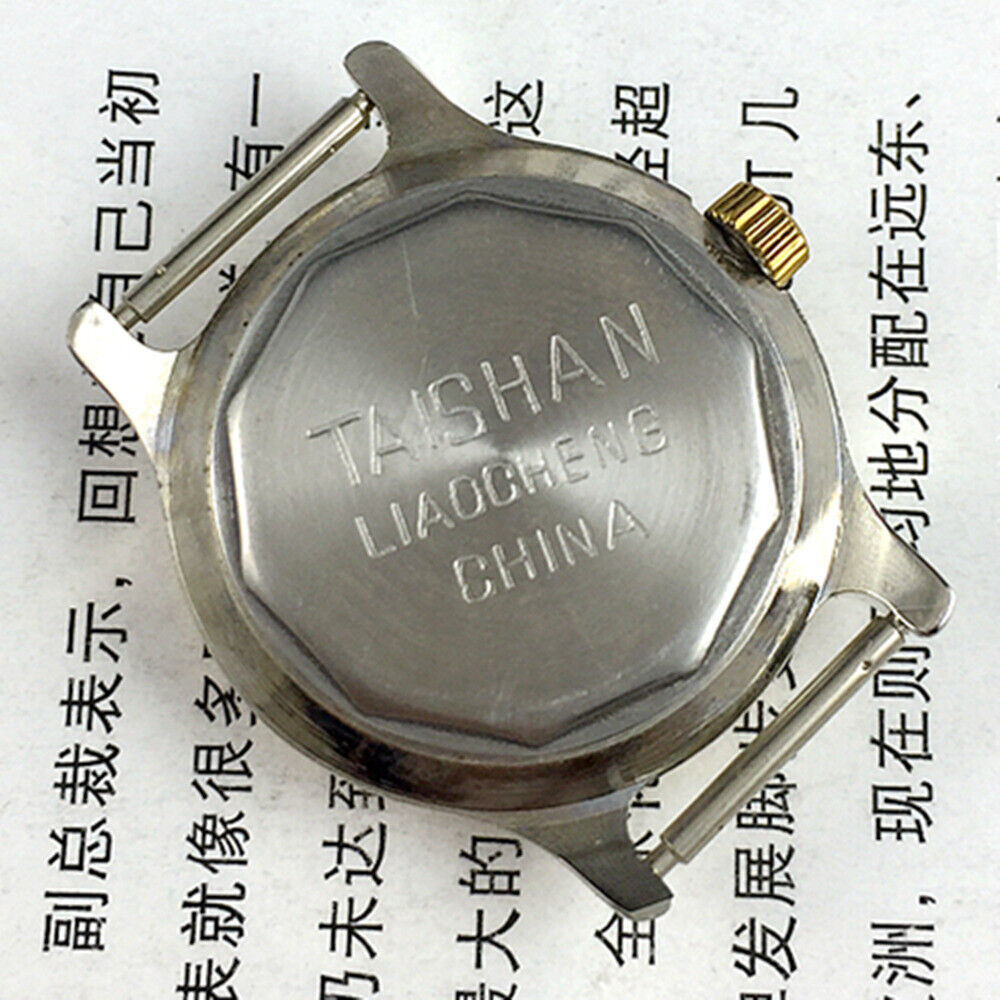 TAISHAN 28mm elegant lady watch with golden case, numeric markers, and manual mechanical movement.