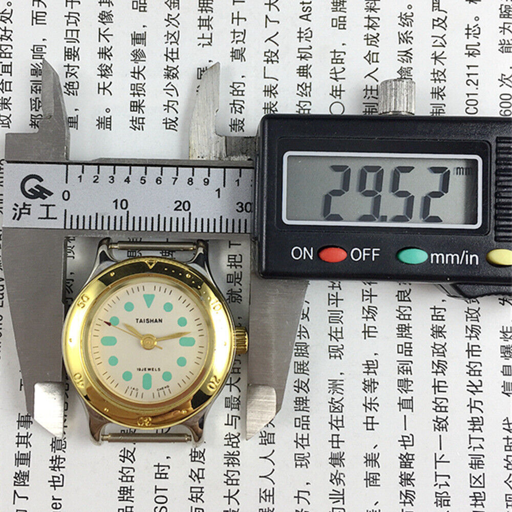 TAISHAN 28mm lady watch with golden case, numeric markers, manual mechanical movement, and 19 jewels for elegant style.