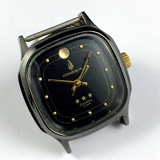 34mm Dandong manual watch with black dial, gold markers, 19 jewels, and three hands for precision timekeeping.