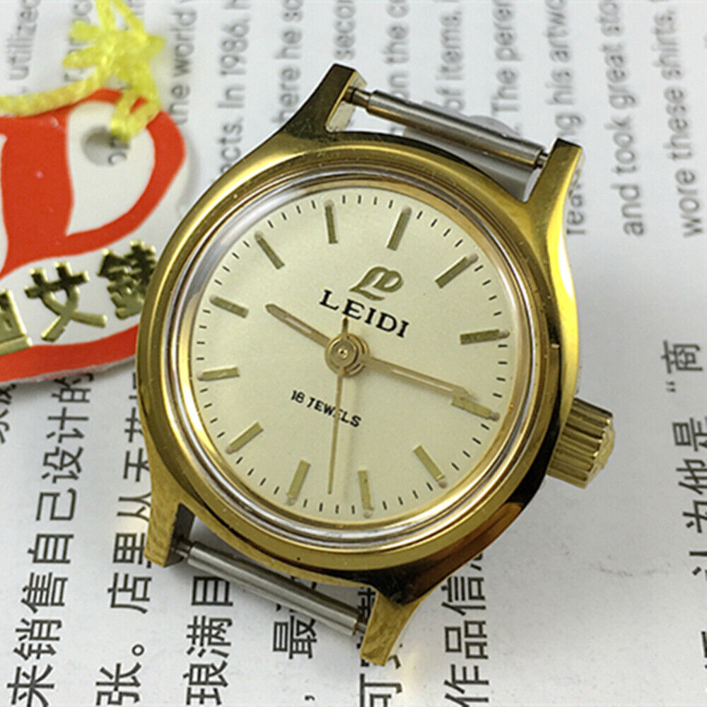 27mm Leidi Steel Lady Watch with golden dial and 18 jewels, featuring matching band for elegant everyday wear.