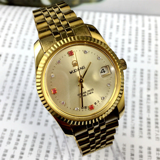 Wudang 38mm steel manual mechanical watch with 17 jewels, golden dial, and single calendar display.