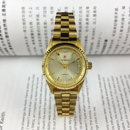 Elegant 27mm TAISHAN manual mechanical lady watch with imitation diamond markers and 19 jewels.