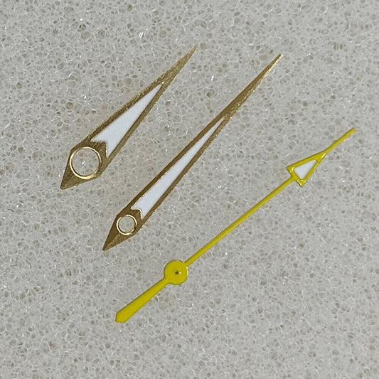 Golden arrow-shaped luminous watch hands with green trim, compatible with NH35/NH36/4R/7S movements.