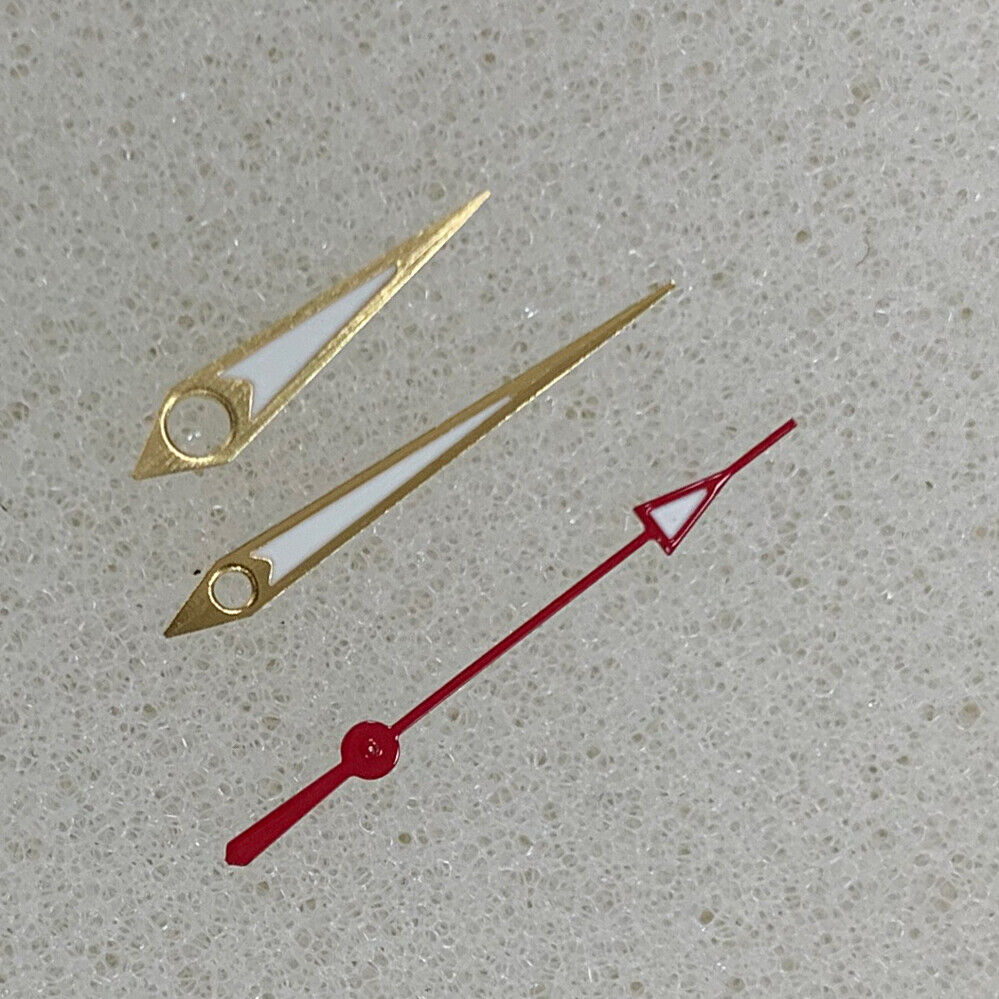 Golden arrow-shaped luminous watch hands with green trim, compatible with NH35/NH36/4R/7S movements, ideal for precise timekeeping.